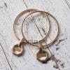 yuvarlak metal aparatli canta sapi gold ritzz 10cm