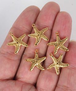 metal canta aksesuar figurler deniz yildizi gold